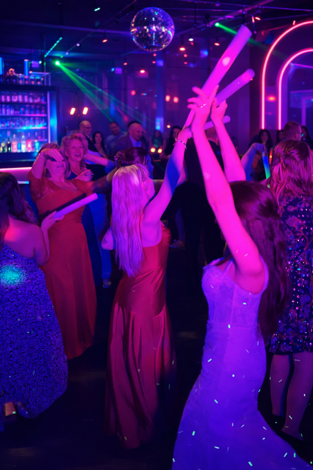 Bride dancing on the dance floor while DJ Spyder Beats mixes live at a wedding reception