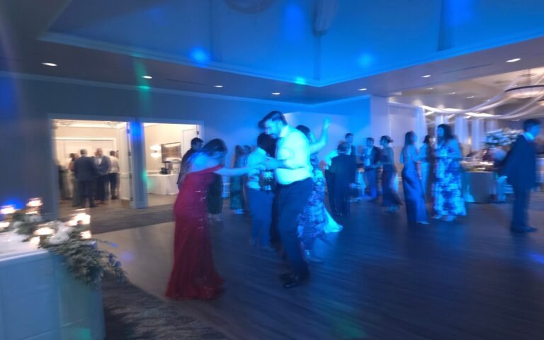 DJ Spyder Beats mixing music during a wedding reception