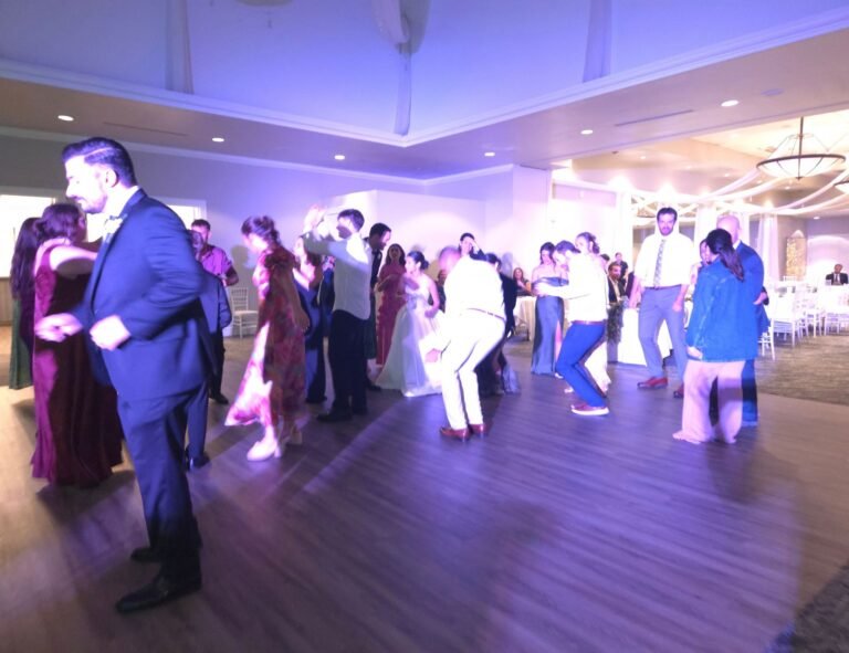 Wedding DJ mixing music during a reception celebration