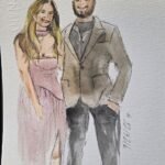 Wedding guests holding personalized watercolor portraits