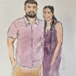 Live wedding guest portrait painting station with watercolor artwork