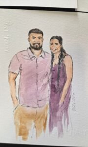 Live wedding guest portrait painting station with watercolor artwork