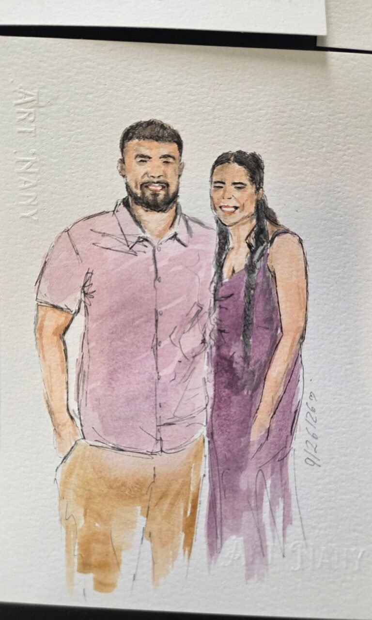 Live wedding guest portrait painting station with watercolor artwork