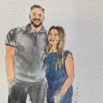 Live wedding guest portrait painting station with watercolor artwork