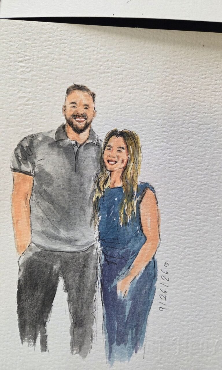 Live wedding guest portrait painting station with watercolor artwork